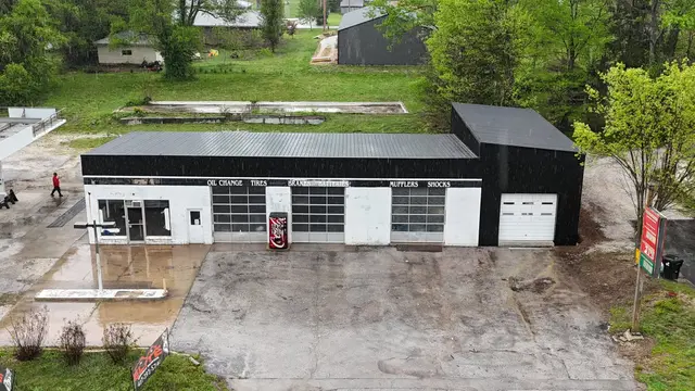 Commercial building with a new black metal roof, front view